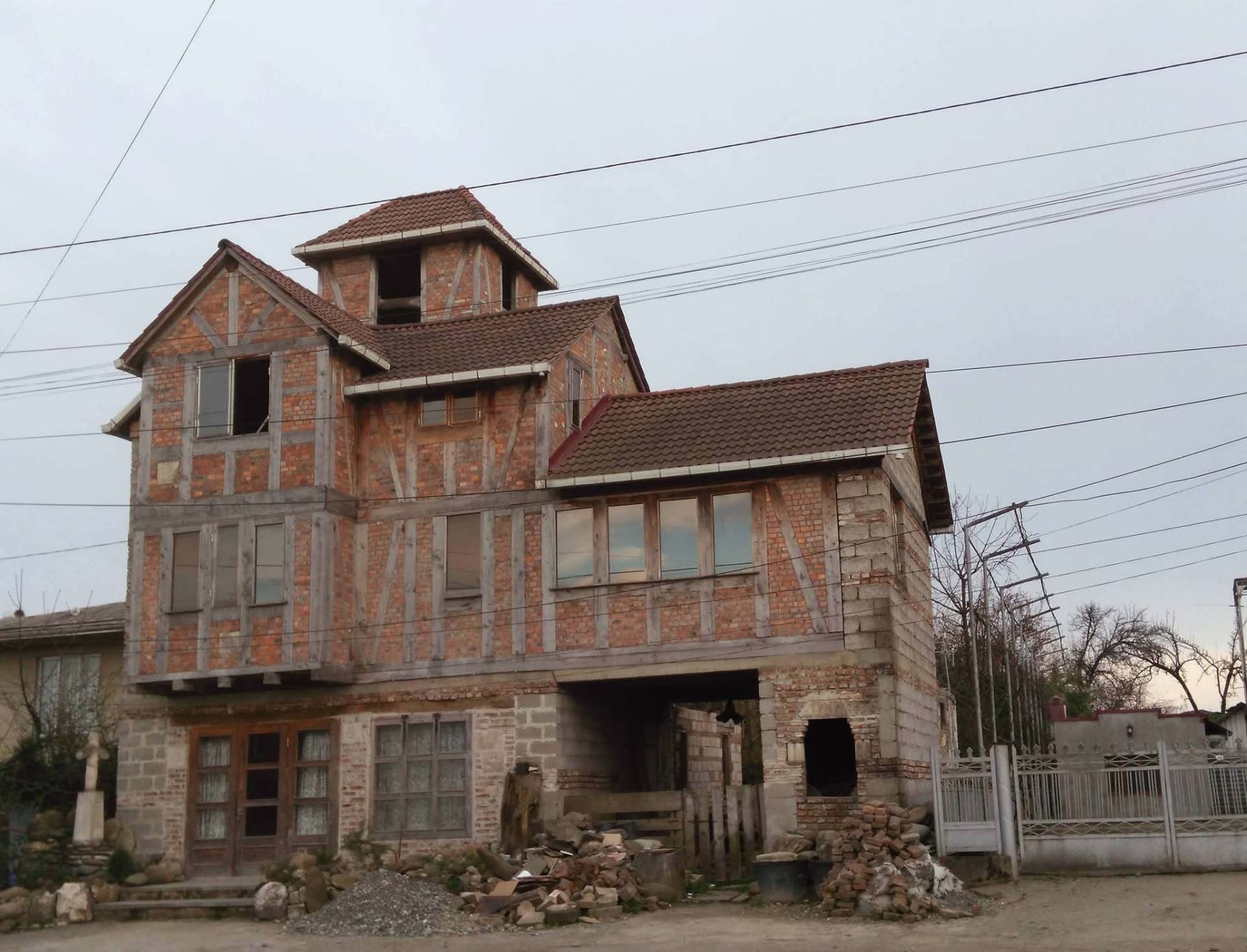 Folk House — handcrafted timber-and-brick exterior